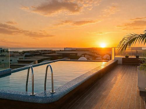 Shared rooftop pool at sunset
