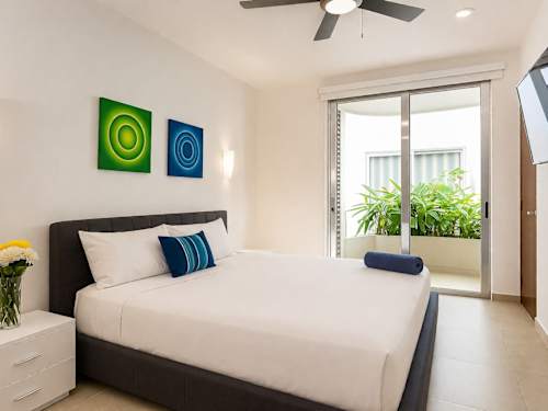 Bedroom with queen bed and balcony