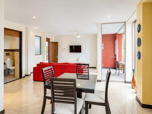 Living room with sofa bed and dining area.