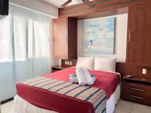 Restful bedroom with a plush bed and fresh linens for a great night's sleep by the sea