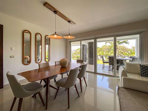 Open living and dining area opening to the balcony