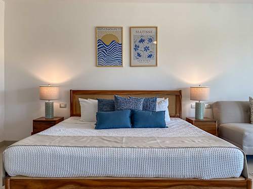 Master bedroom with King bed and balcony access