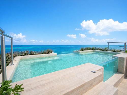 Shared rooftop infinity pool overlooking the sea