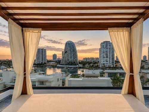 Shared rooftop terrace lounge at sunset