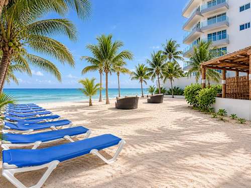 Sun loungers facing the turquoise Caribbean