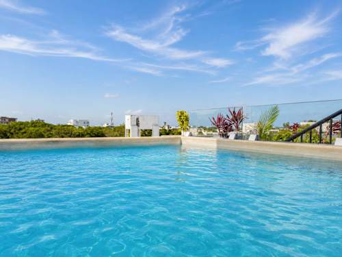 Shared rooftop pool with Caribbean views