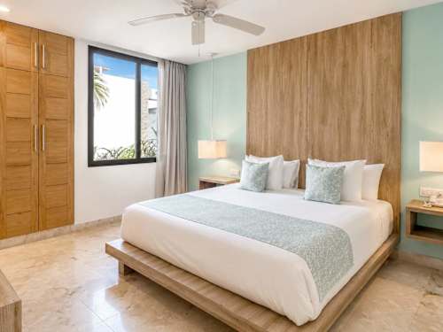 Private bedroom with comfortable bed and air conditioning
