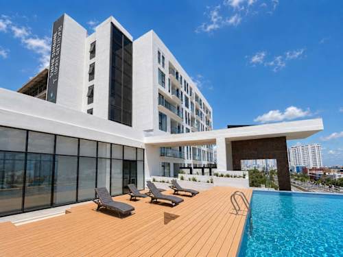 Building exterior with rooftop pool