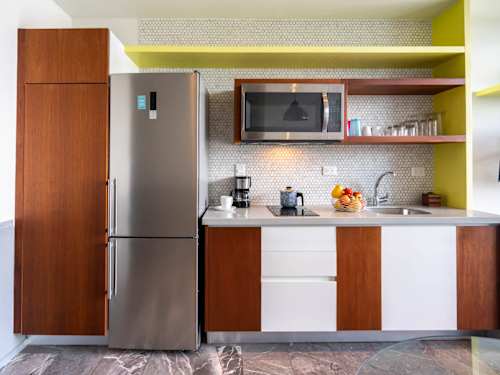 Fully equipped kitchenette with a full fridge and microwave, everything you need to cook in and stay a while