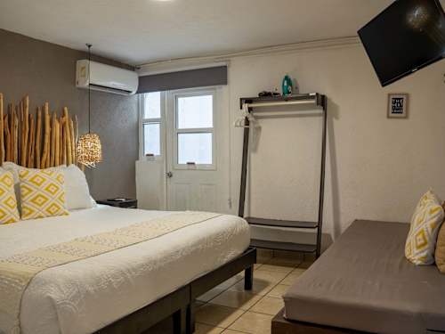 Spacious king bed plus a sofa bed, flexible sleeping for up to three guests