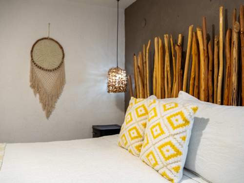 Cozy bedroom with warm boho touches and a comfy king bed for a great night's sleep
