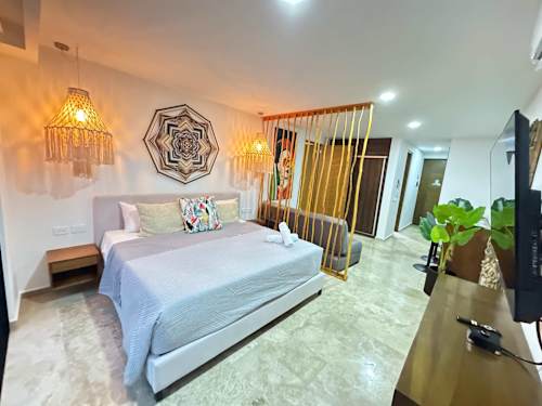 Restful studio bedroom with boho decor and a Smart TV, a comfortable base steps from 5th Avenue