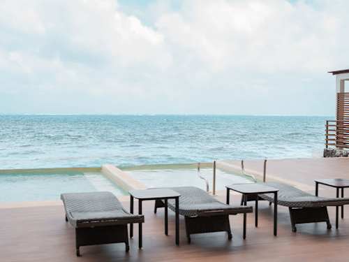 3BR beachfront apartment in Puerto Morelos featuring a rooftop pool