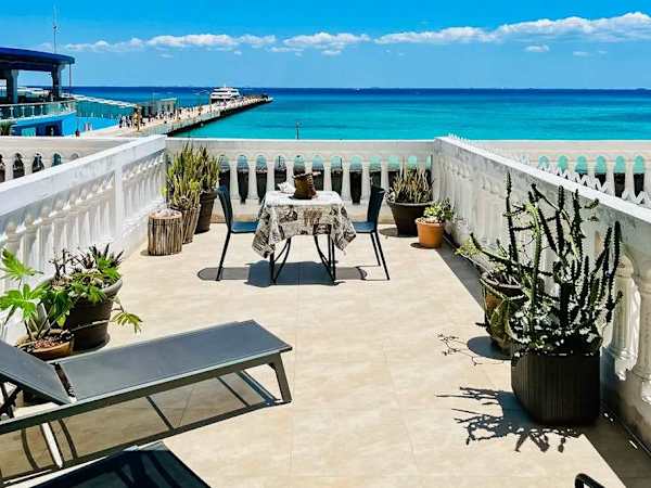 Beachfront 1BR Suite with Terrace & Ocean View