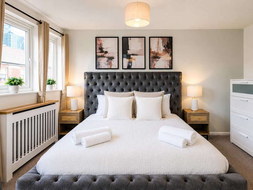A converted cotton-mill apartment managed by Hostahome in Ancoats, Manchester.
