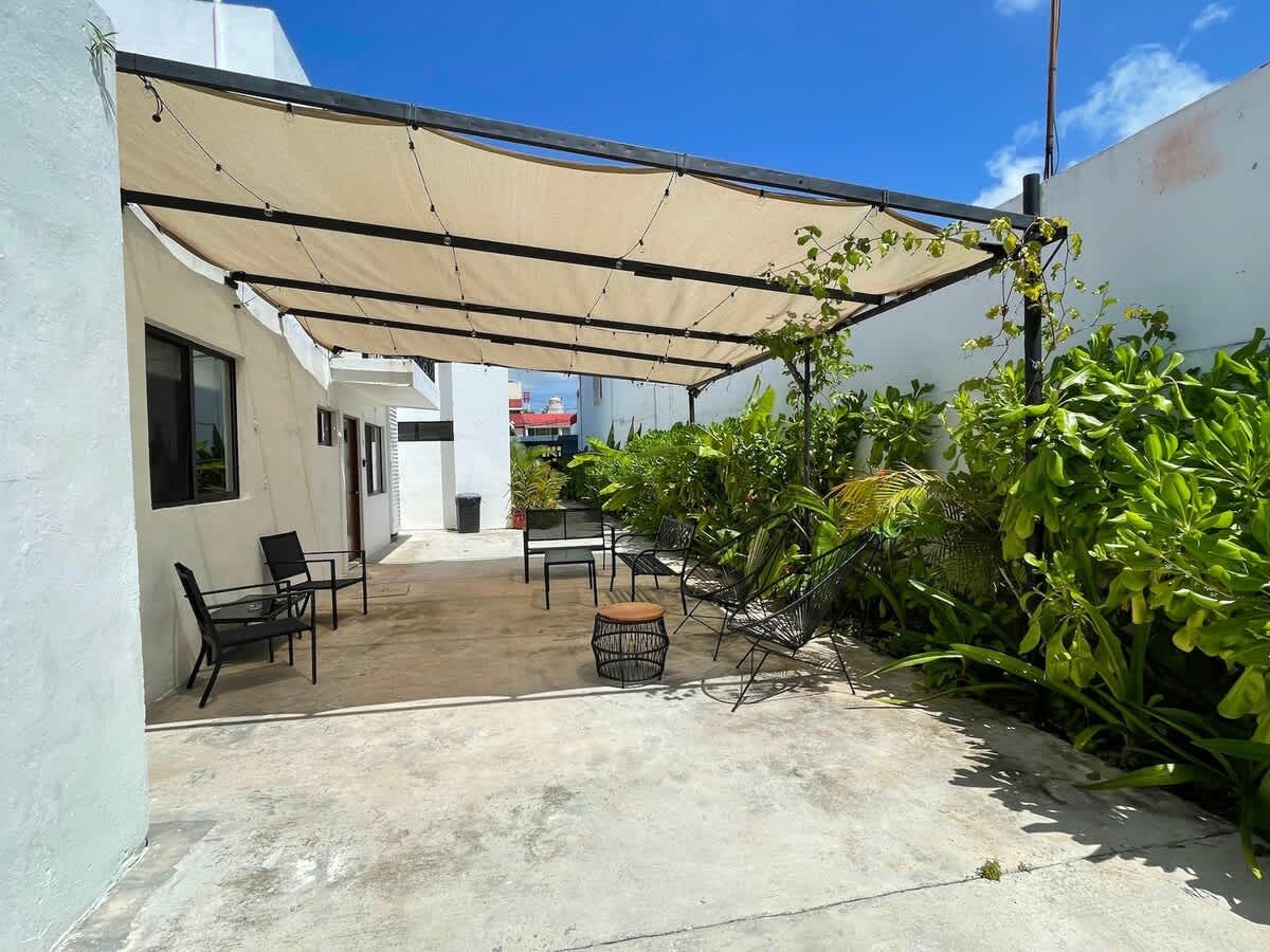 Shared tiled garden patio for guests
