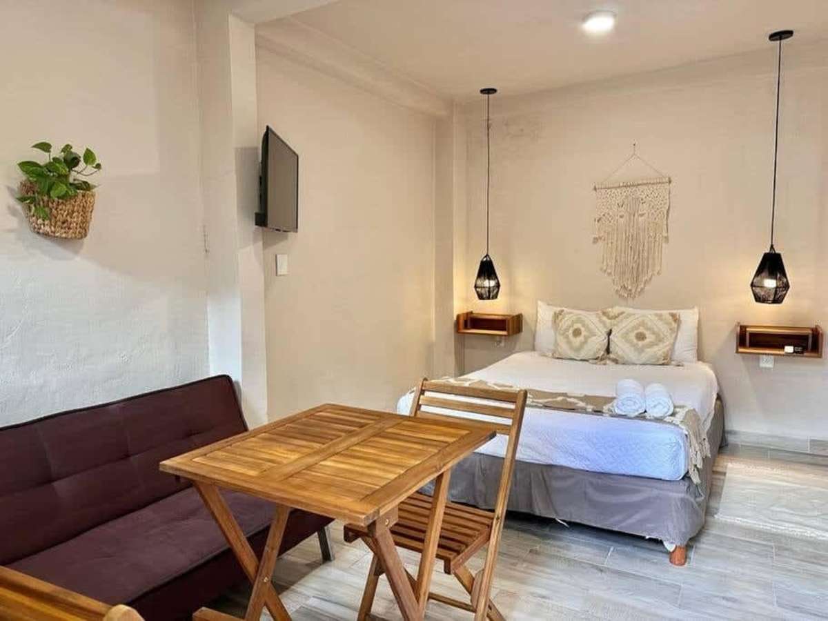 Living and dining area with sofa.