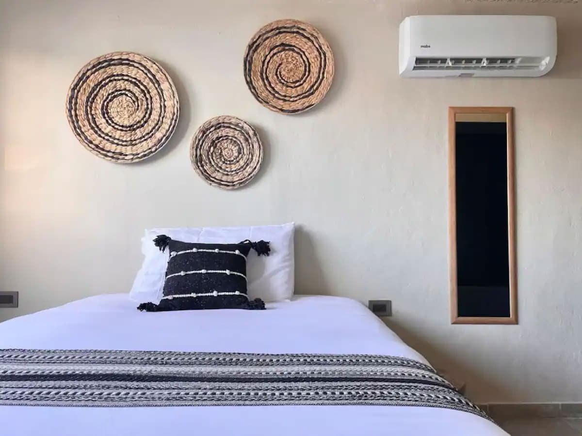 Comfortable double bed in a bright, modern studio