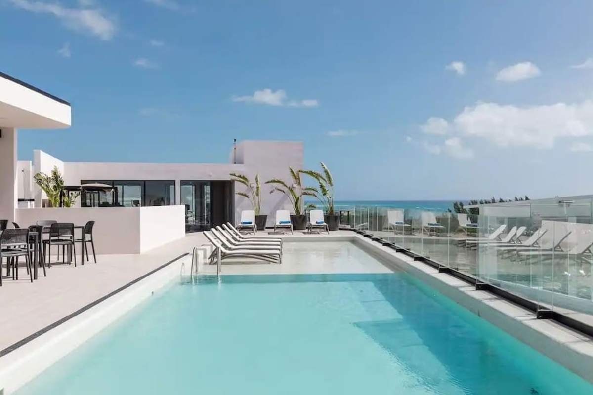 Shared rooftop pool with ocean view