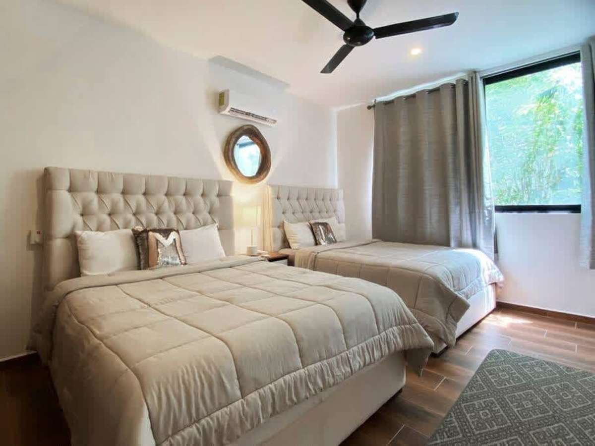 Bedroom with king bed, A/C and ceiling fan