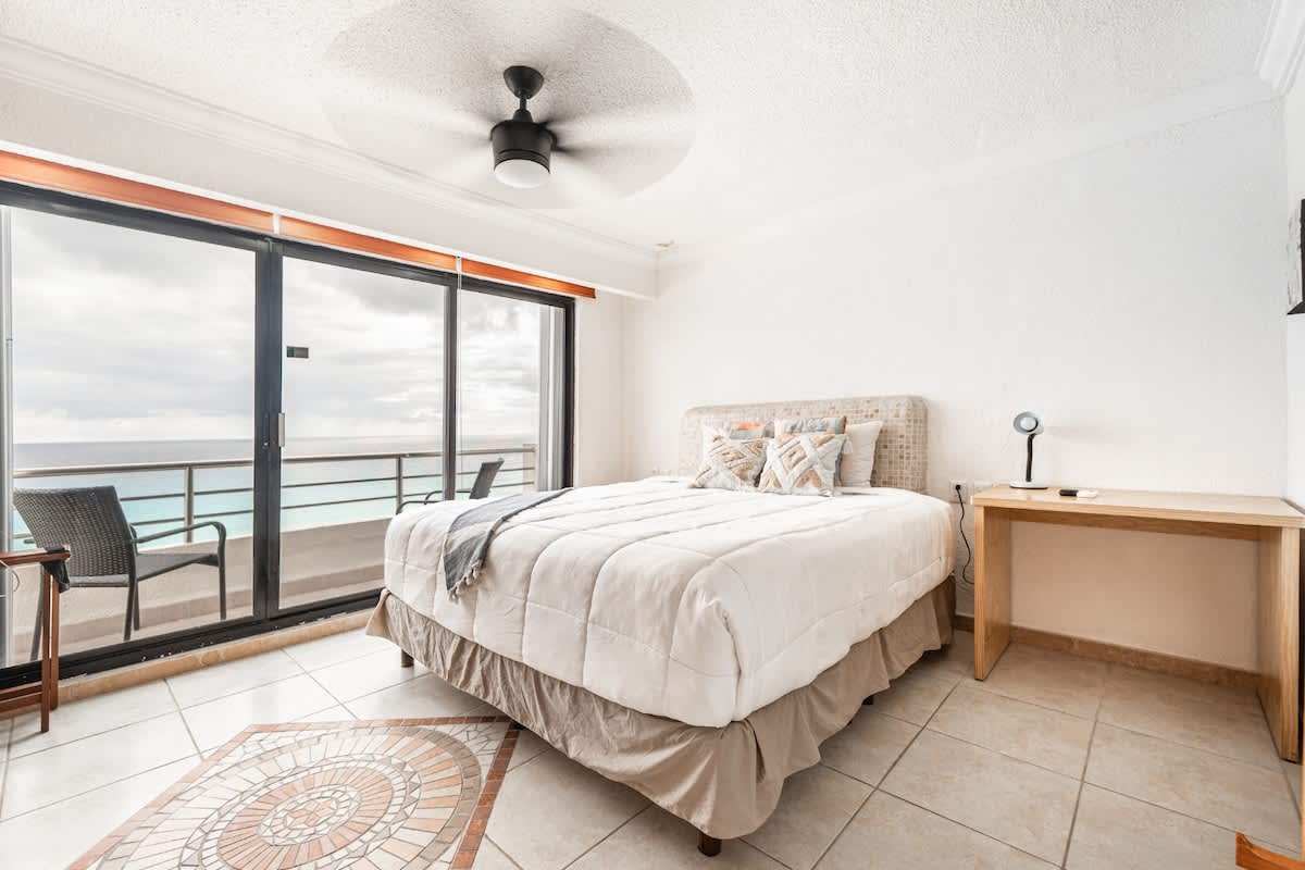Bedroom with King and single bed, ocean view