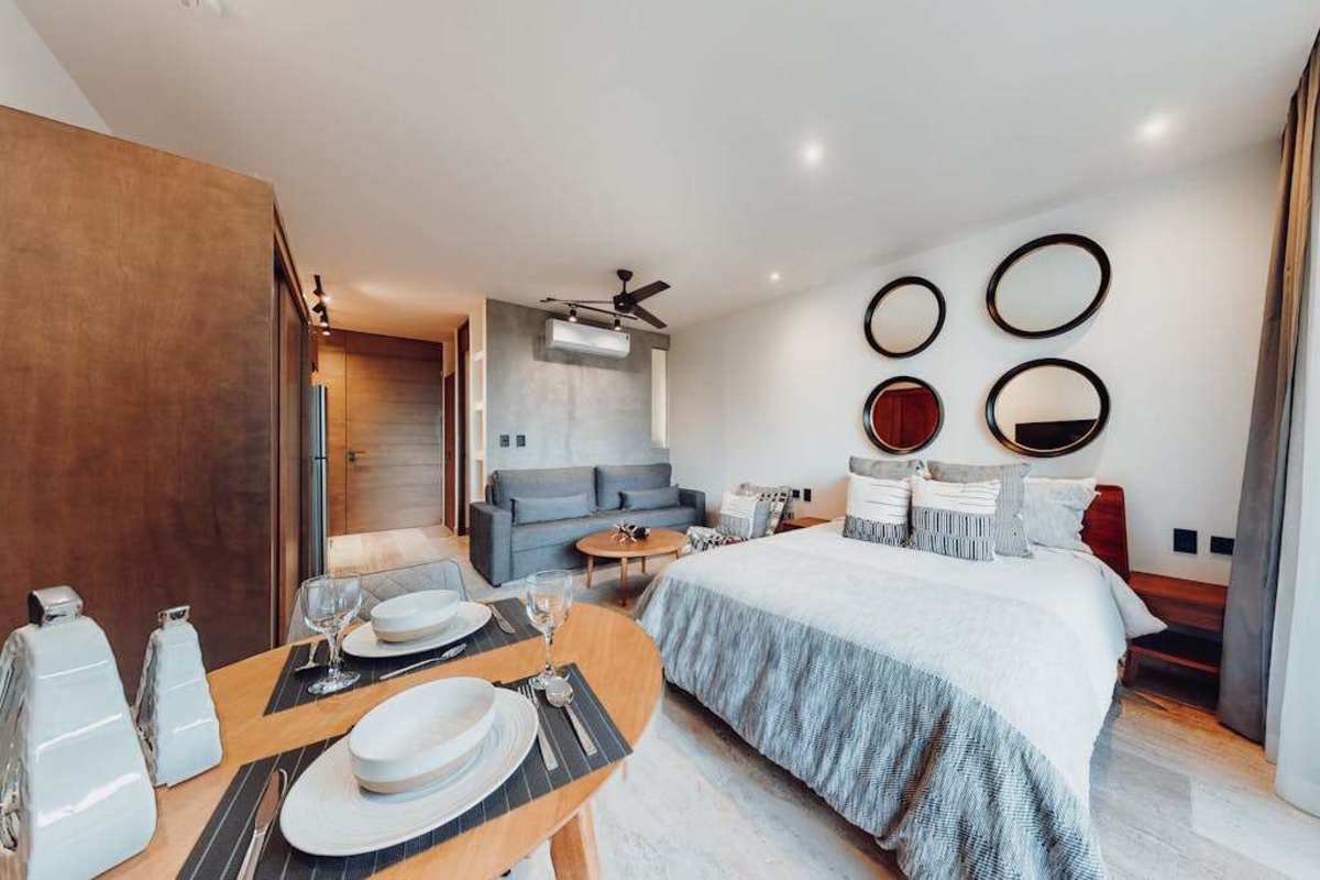 Open-plan living, dining, and kitchenette area