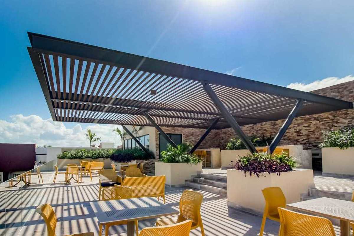 Shared rooftop pool and lounge area