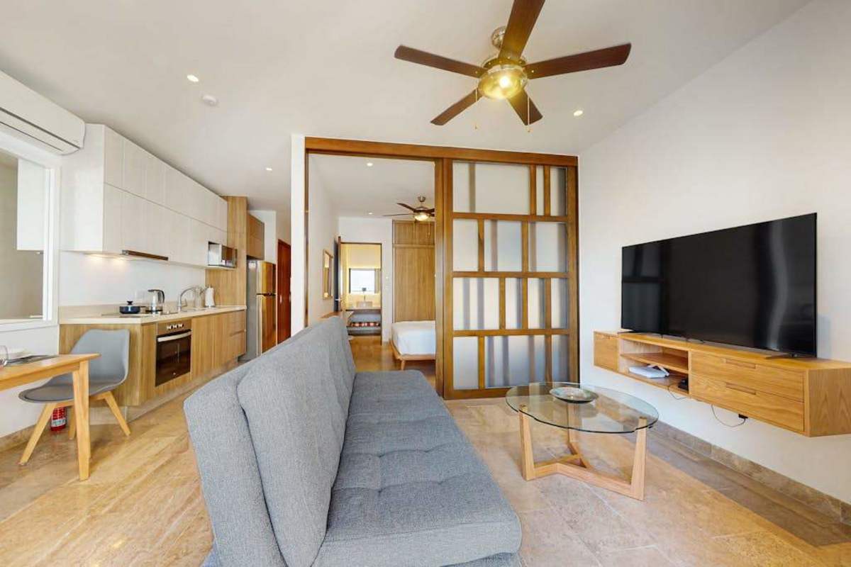 Living area with sofa bed and balcony access