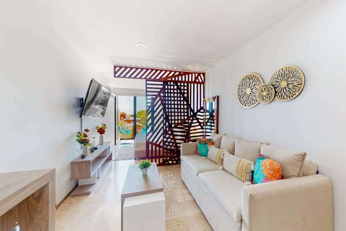 Studio living area with sofa and smart TV