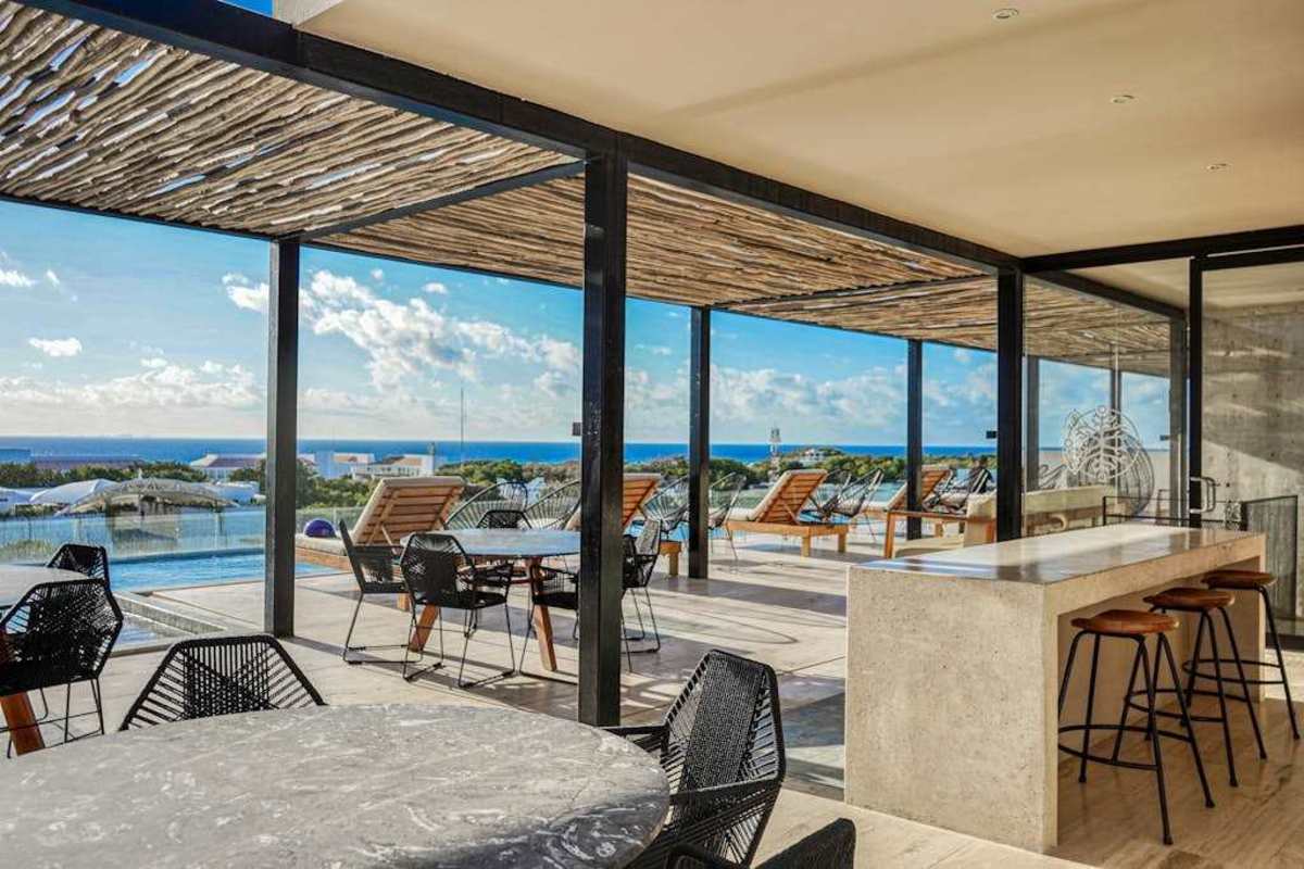 Shared rooftop terrace lounge and dining with sea views