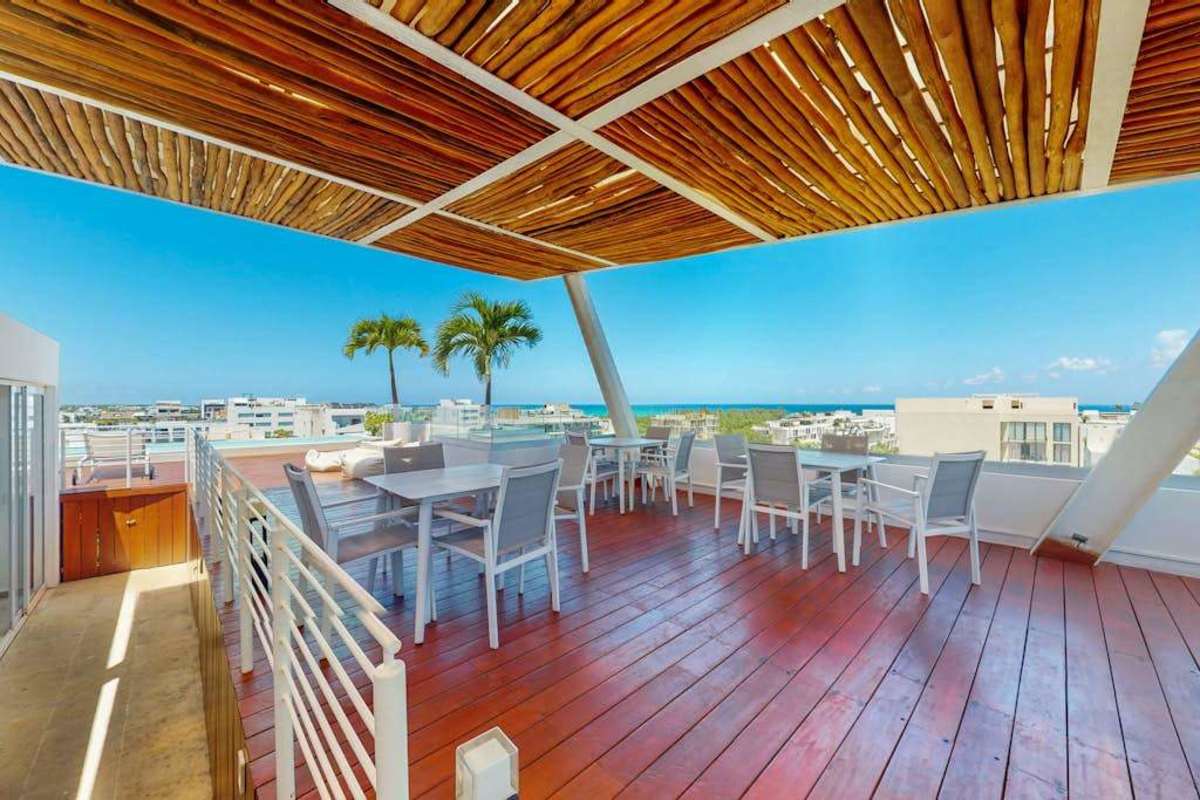 Shared rooftop terrace with lounge and dining