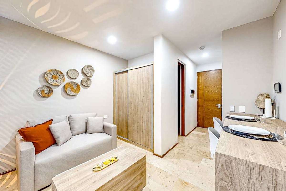 Open-concept studio with king bed and seating
