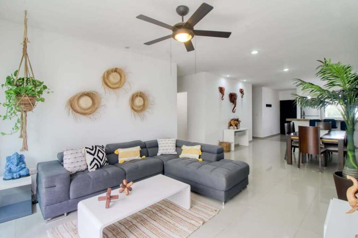 Living area with sofa and ceiling fan