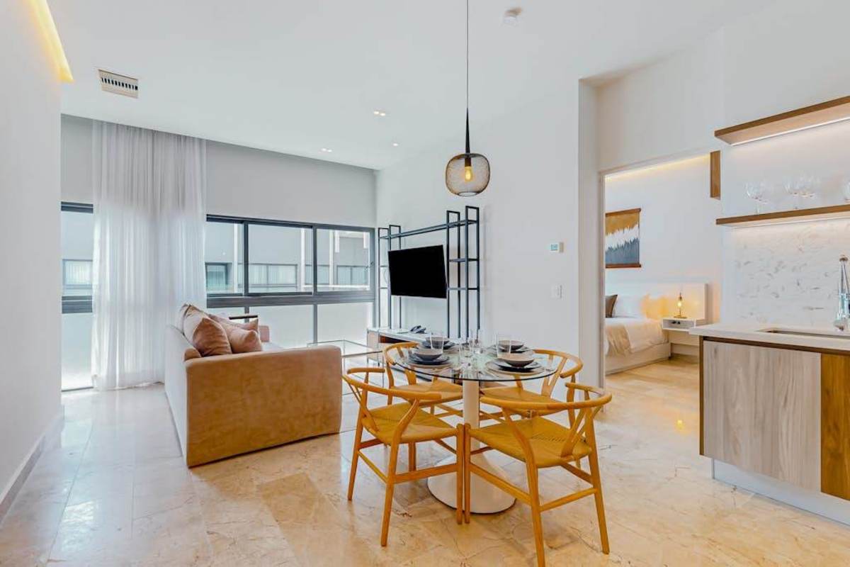 Open-concept living and dining area with modern kitchen