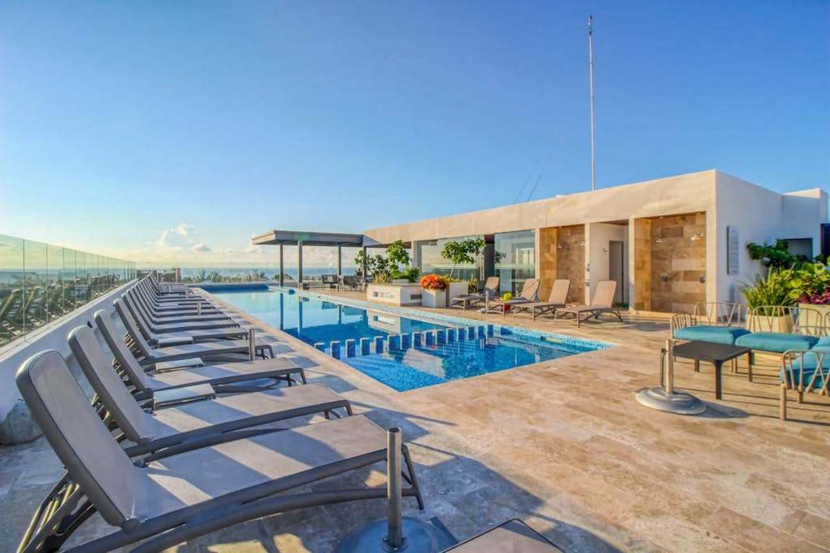 Shared rooftop pool with city views