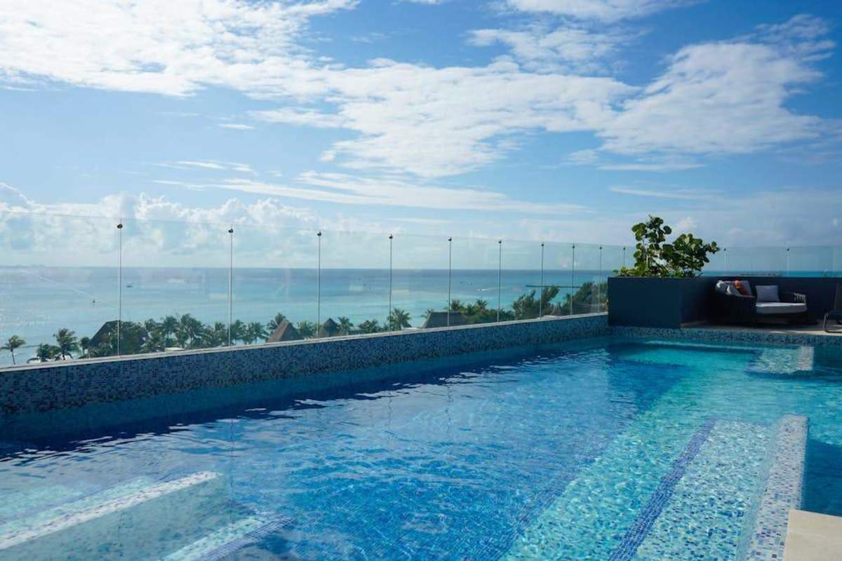 Shared rooftop pool with ocean views