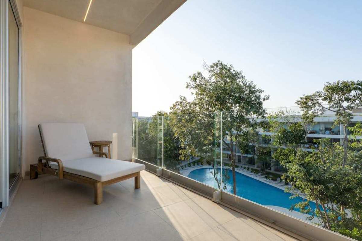 Private balcony with pool and garden views