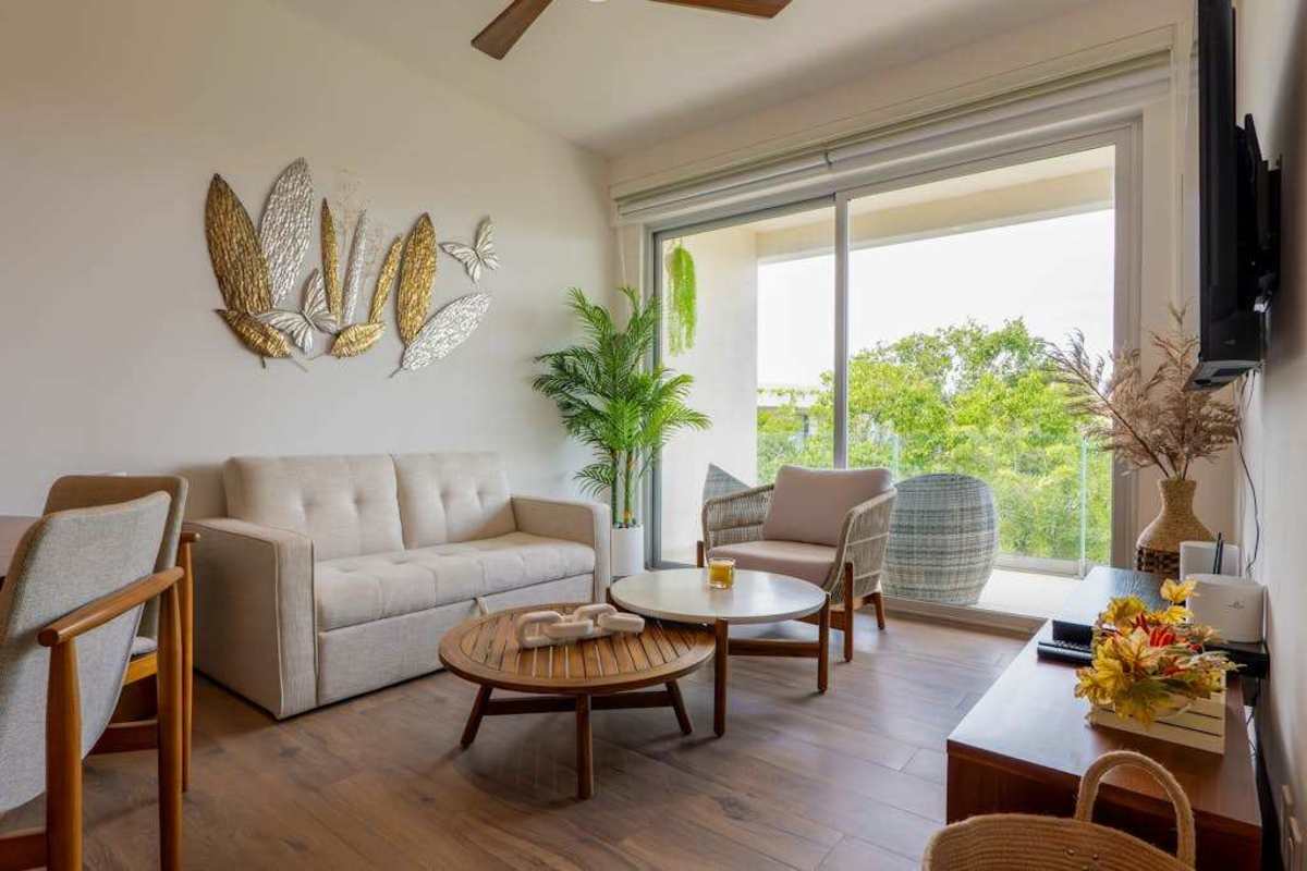 Living room opening to a private balcony