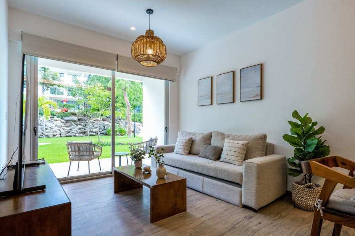 Bright living room with sofa and balcony