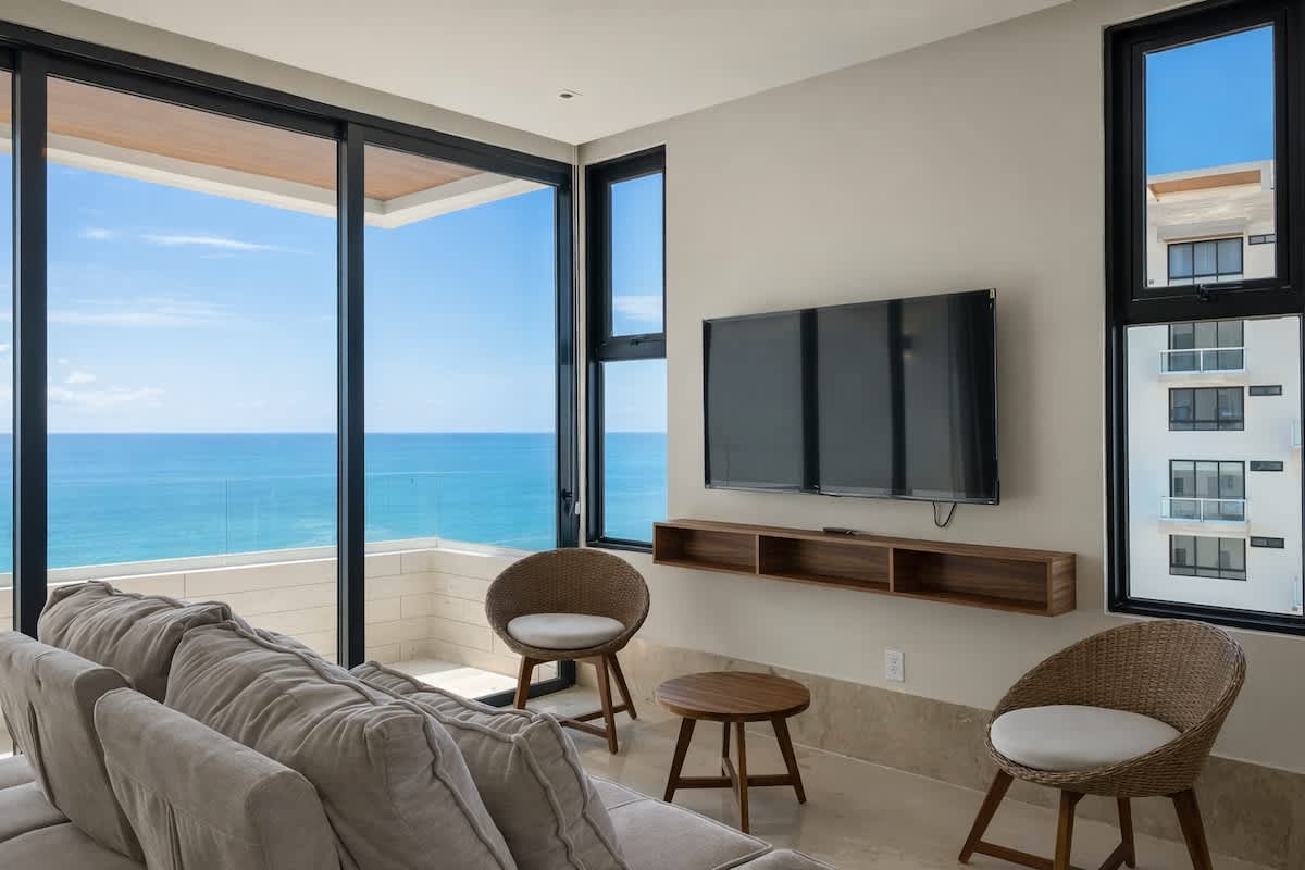 Living area with floor-to-ceiling ocean views