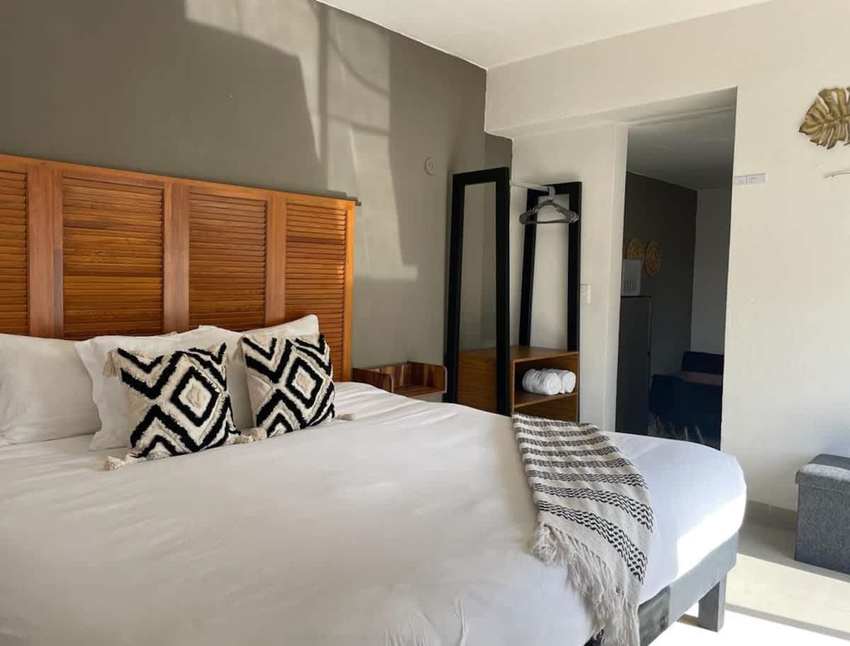 Bedroom area - King bed with accent wall and Smart TV