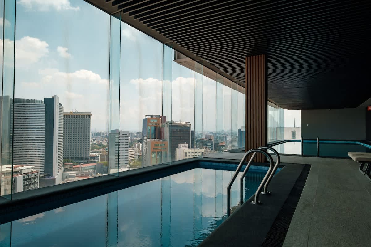Rooftop infinity pool that seems to spill into the Reforma skyline, your private escape high above the city