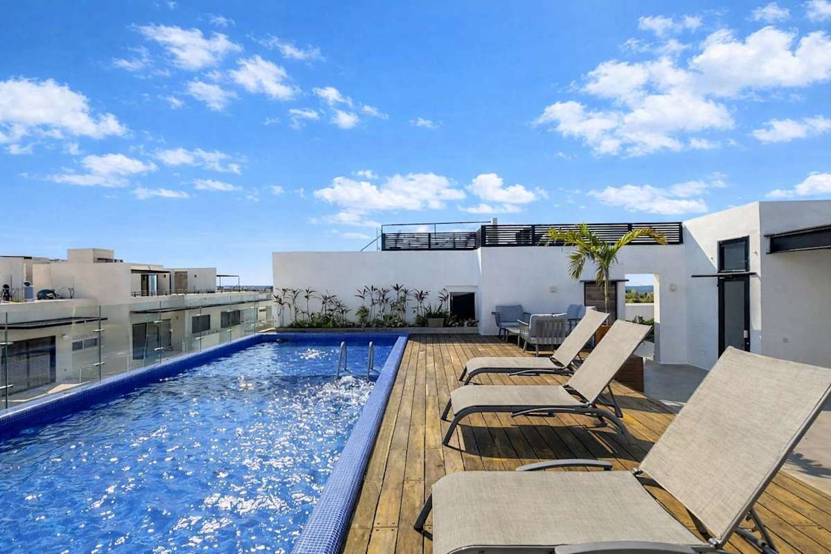 Rooftop pool deck with ocean views (shared common area)
