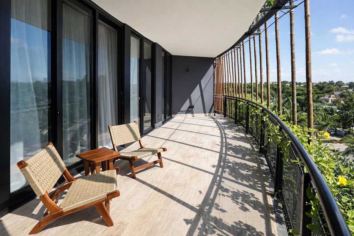 Private balcony overlooking lush greenery