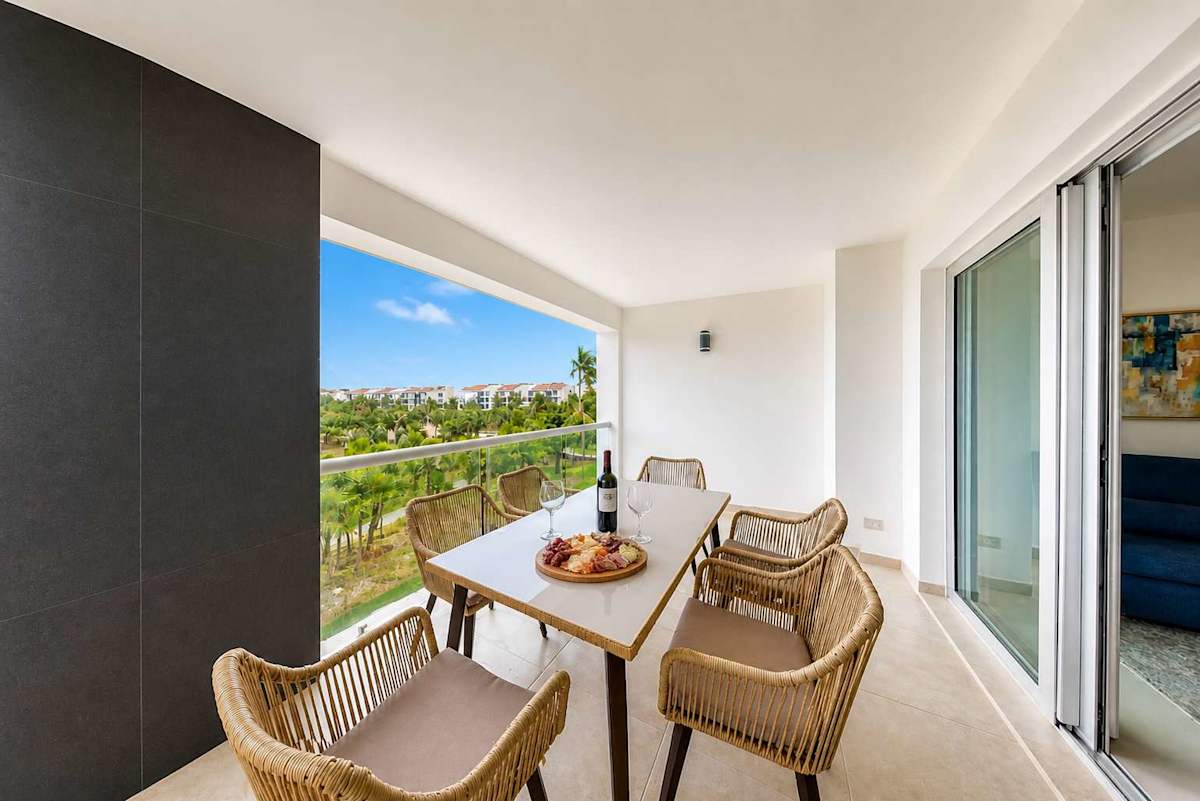 Private balcony with dining and garden views