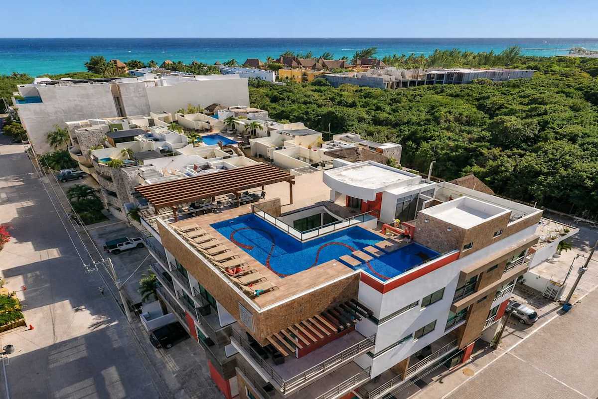 Building with shared rooftop pool