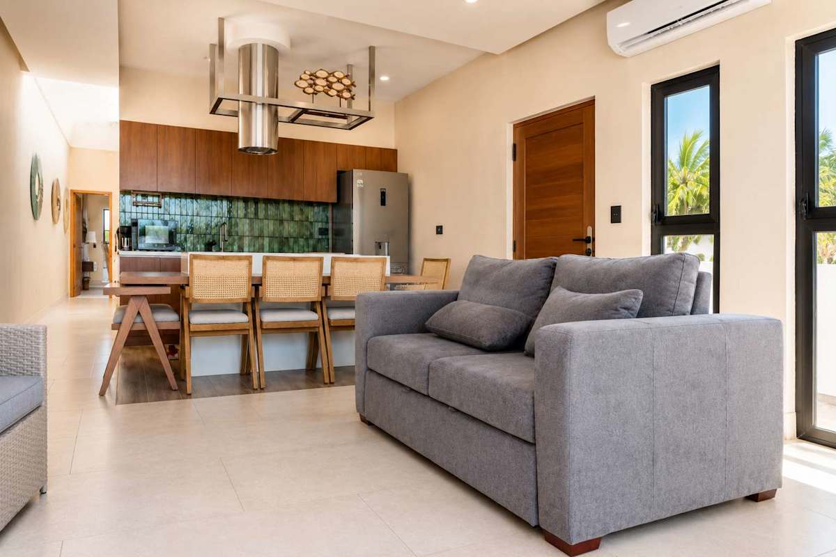 Open living room with sofas and terrace access