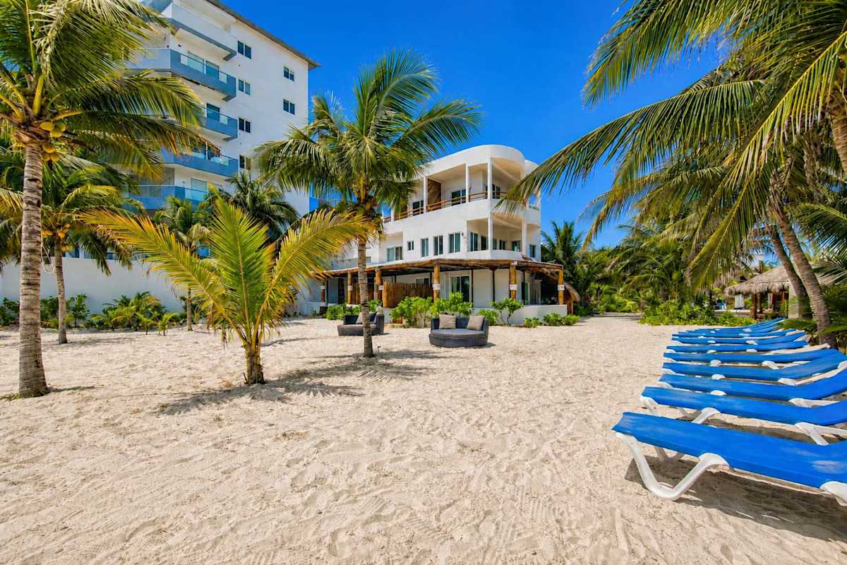 Beach loungers on the white-sand Caribbean beach