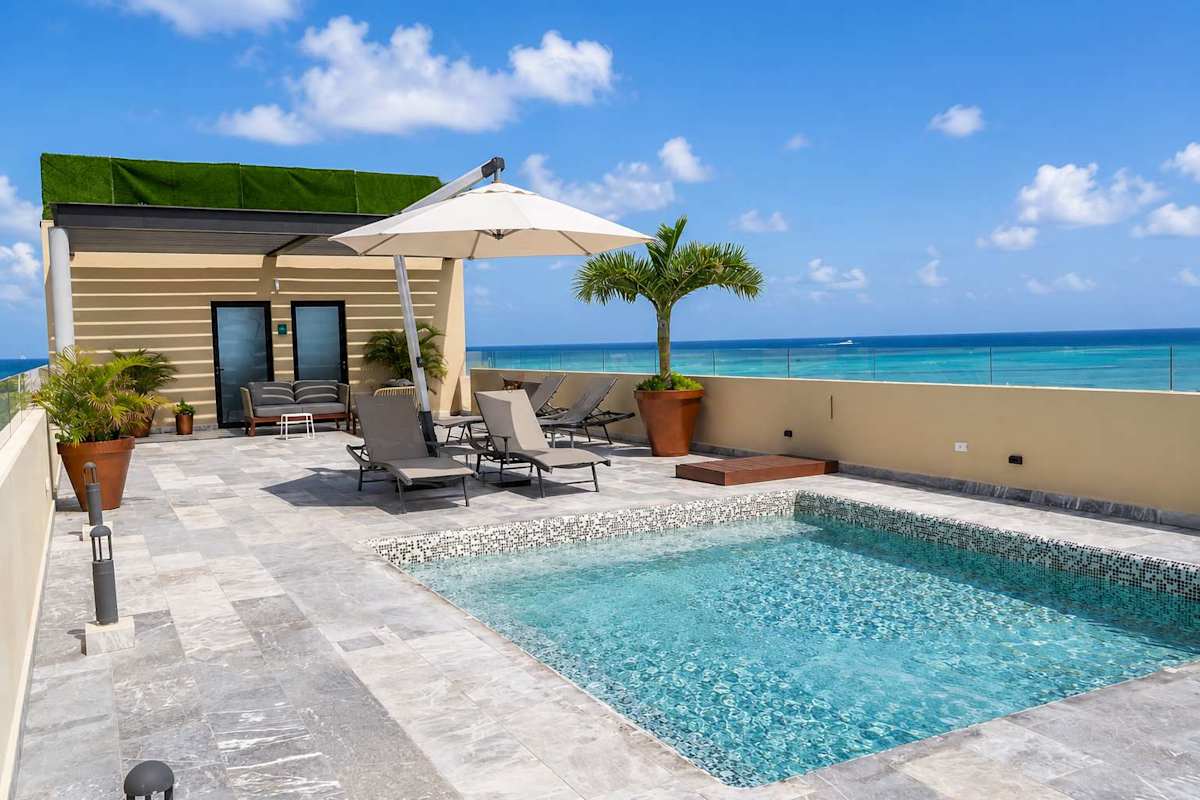 Shared rooftop pool with ocean views