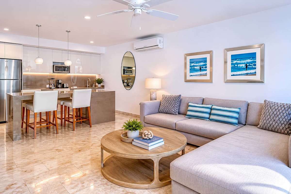 Open-concept living and dining area with sofa and smart TV